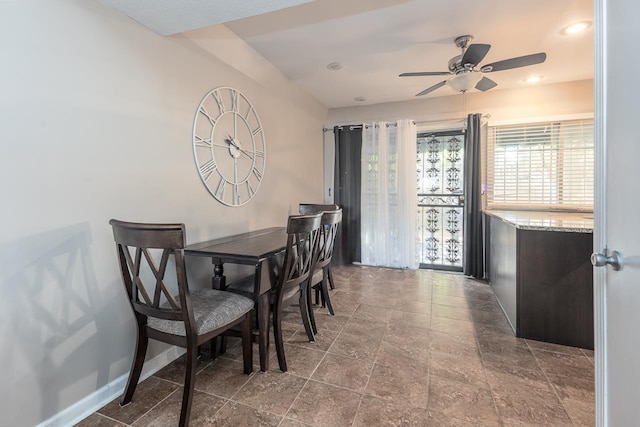 dining space featuring ceiling fan