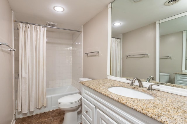 full bathroom featuring vanity, toilet, and shower / tub combo