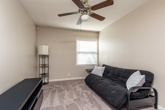 carpeted living room with ceiling fan