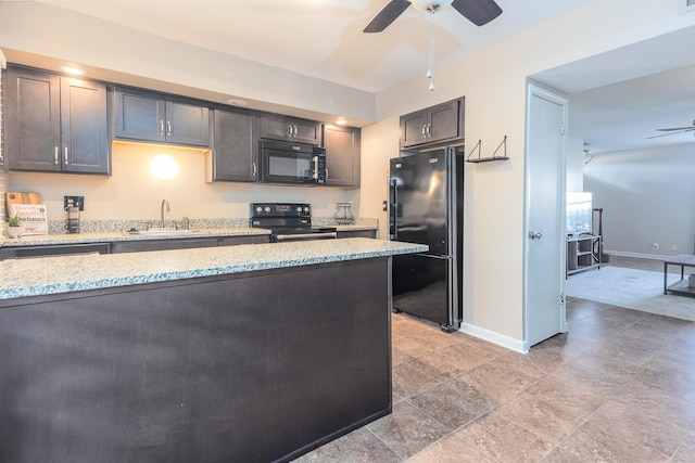 kitchen featuring black appliances, sink, dark brown cabinetry, light stone counters, and ceiling fan