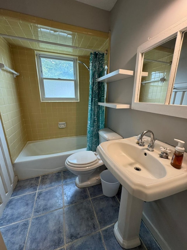 bathroom with shower / tub combo and toilet