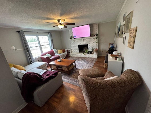 living room featuring crown molding, a brick fireplace, and dark hardwood / wood-style flooring