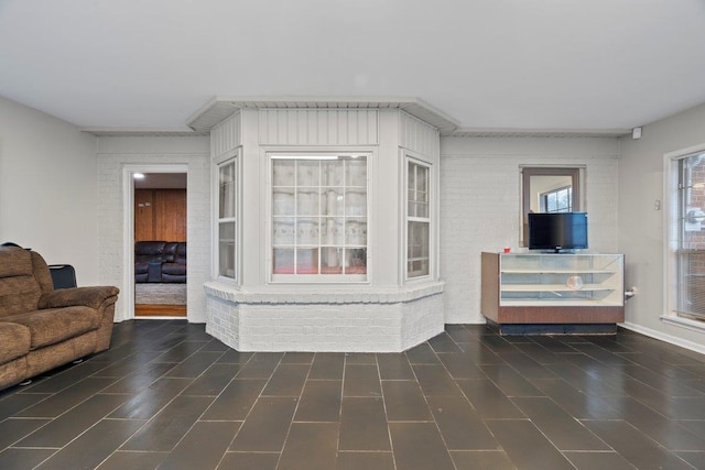 living room with brick wall