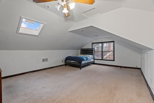 unfurnished bedroom with vaulted ceiling, light carpet, and ceiling fan