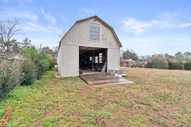 view of outbuilding with a yard