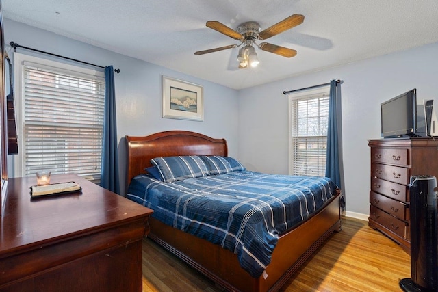 bedroom featuring hardwood / wood-style floors and ceiling fan