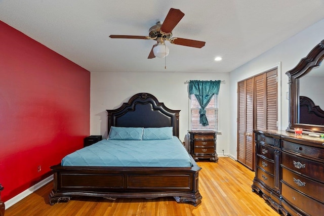 bedroom featuring a closet, ceiling fan, and light hardwood / wood-style flooring