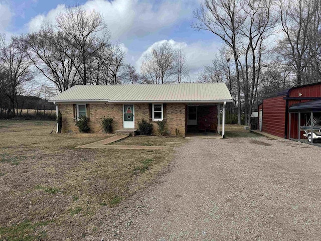 ranch-style home featuring a carport