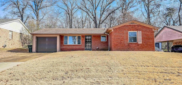 view of front of home with a garage and a front lawn