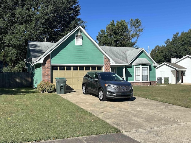 view of front of house featuring a garage and a front yard