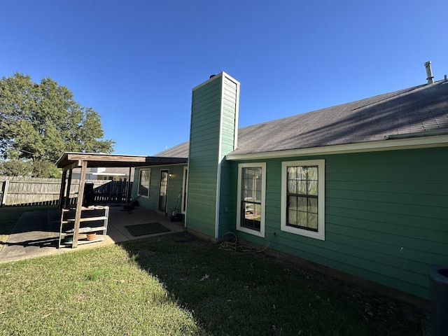 exterior space featuring a yard and a patio area