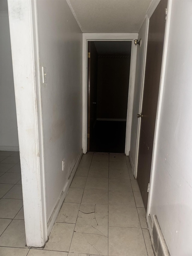 hallway with light tile patterned floors