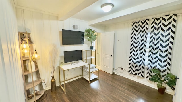 interior space featuring beamed ceiling and dark hardwood / wood-style flooring