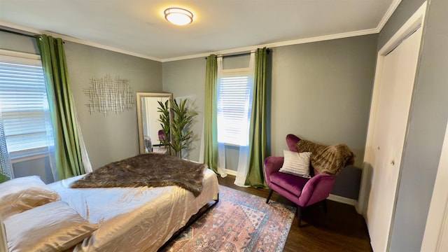 bedroom featuring ornamental molding and dark hardwood / wood-style floors