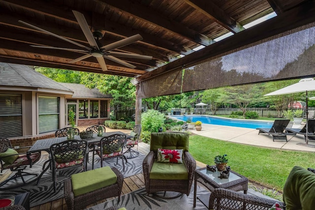 view of patio with a fenced in pool, an outdoor hangout area, and ceiling fan