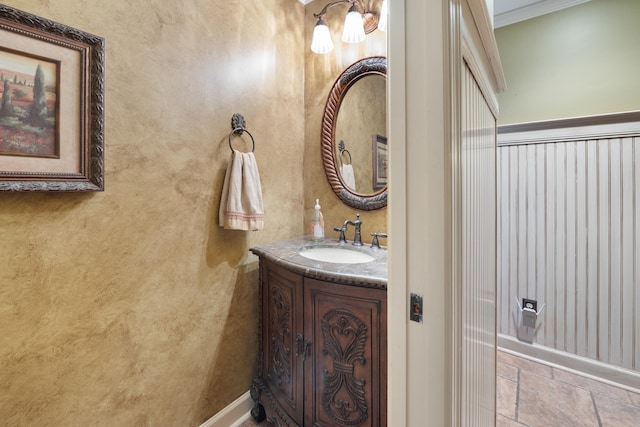 bathroom featuring vanity and crown molding