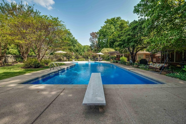 view of swimming pool with a pergola and a diving board