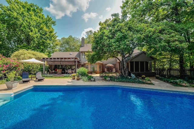 view of swimming pool with a patio and a pergola