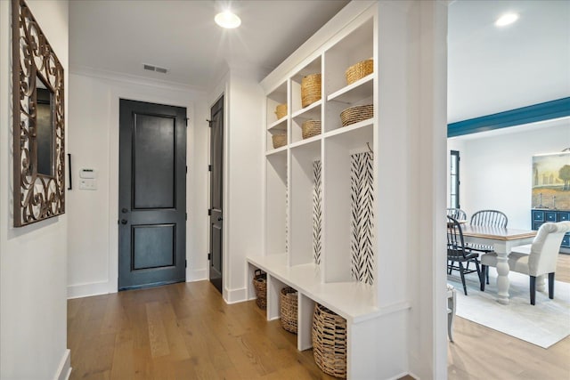 mudroom with wood-type flooring