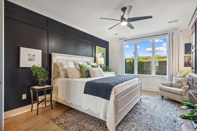 bedroom featuring ceiling fan and hardwood / wood-style floors