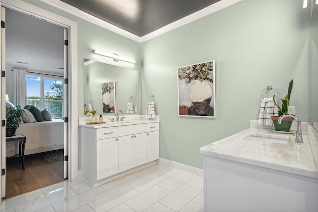 bathroom with vanity, crown molding, and tile patterned floors