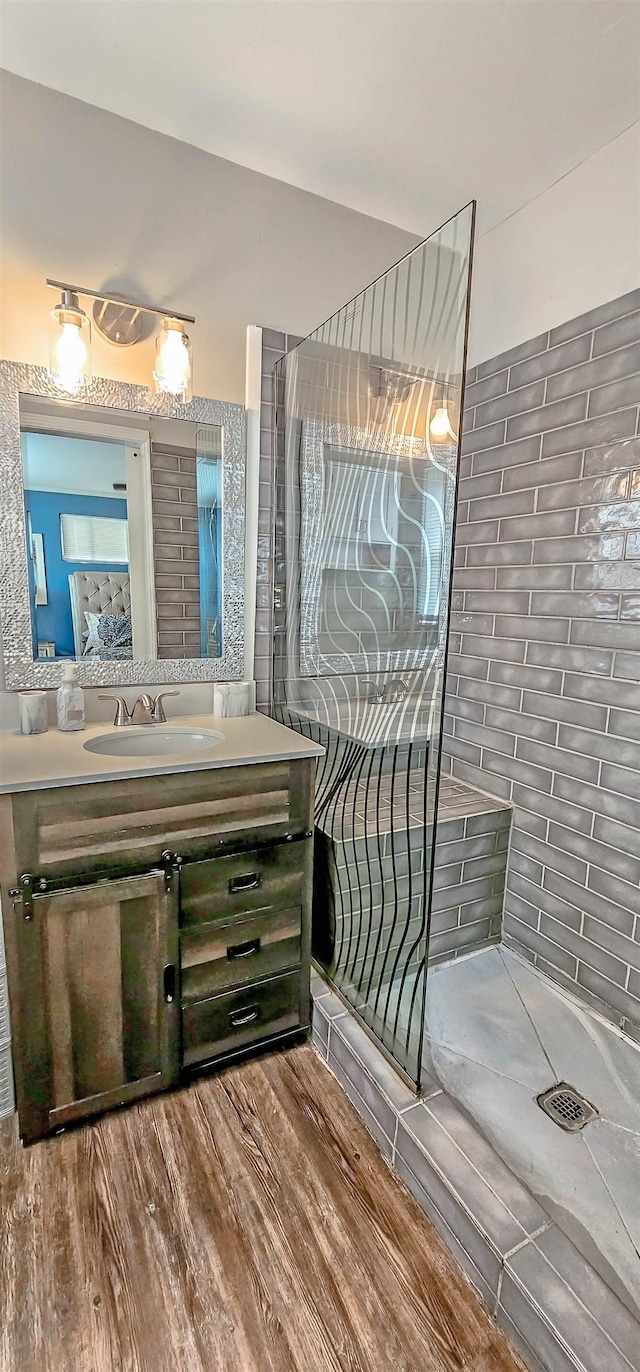 bathroom with wood-type flooring and vanity