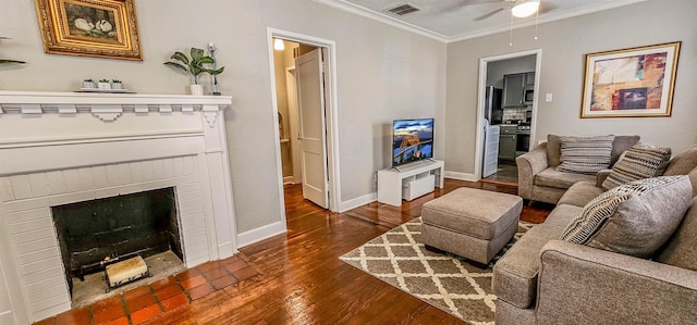 living room featuring a fireplace, dark wood-type flooring, and ornamental molding