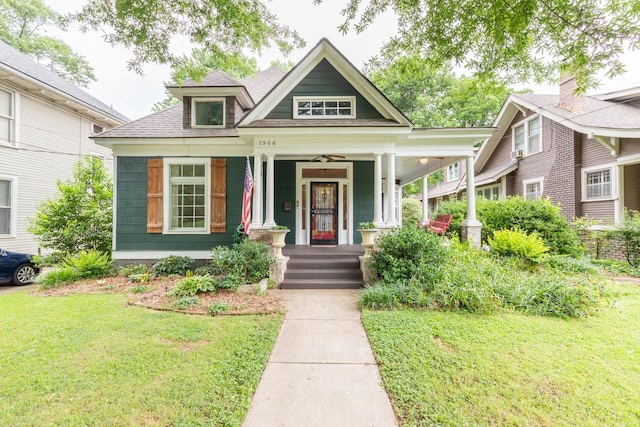 view of front of property featuring a front lawn and covered porch