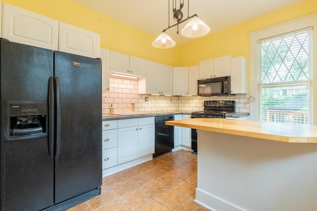 kitchen with white cabinetry, wooden counters, pendant lighting, decorative backsplash, and black appliances