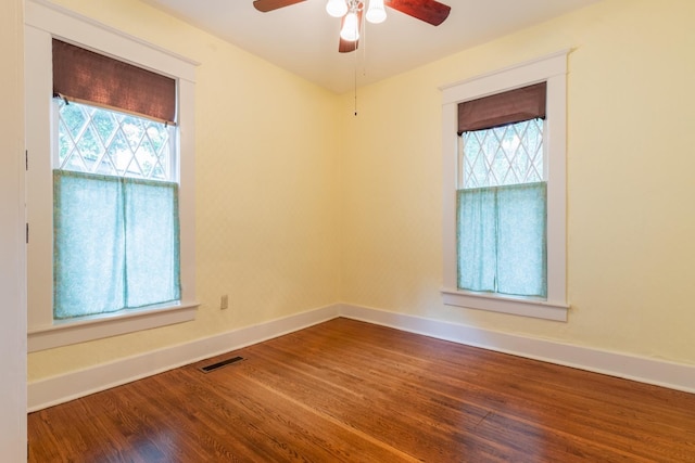 empty room featuring ceiling fan and wood-type flooring