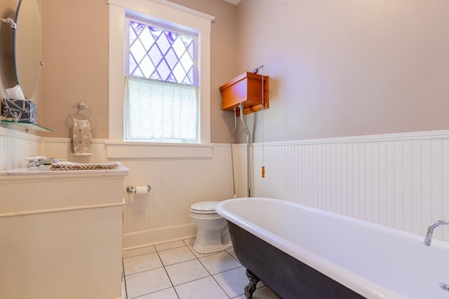 bathroom featuring sink, tile patterned floors, toilet, and a bathtub