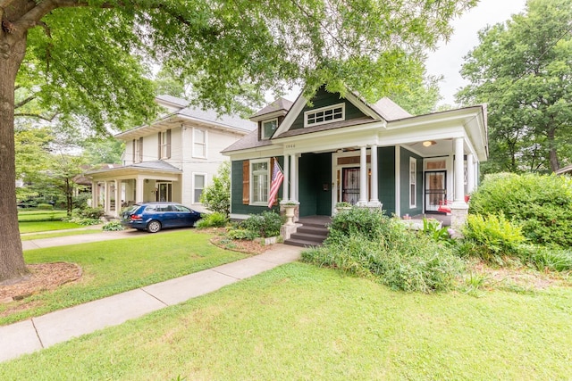 view of front of home featuring a porch and a front lawn