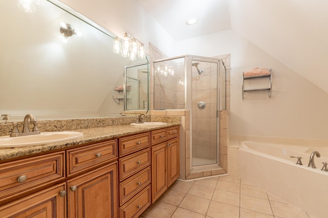 bathroom featuring lofted ceiling, tile patterned floors, plus walk in shower, and vanity