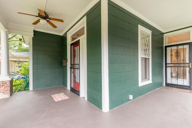 view of exterior entry featuring ceiling fan