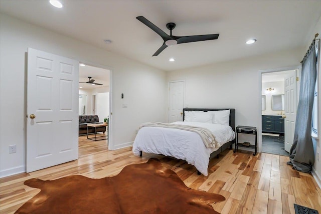 bedroom with connected bathroom, ceiling fan, and light wood-type flooring