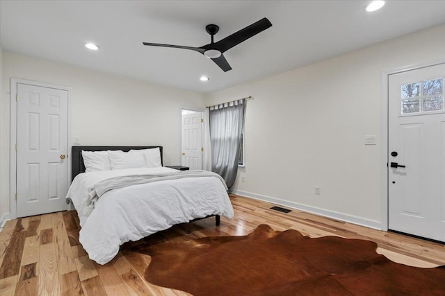 bedroom with ceiling fan and light hardwood / wood-style floors