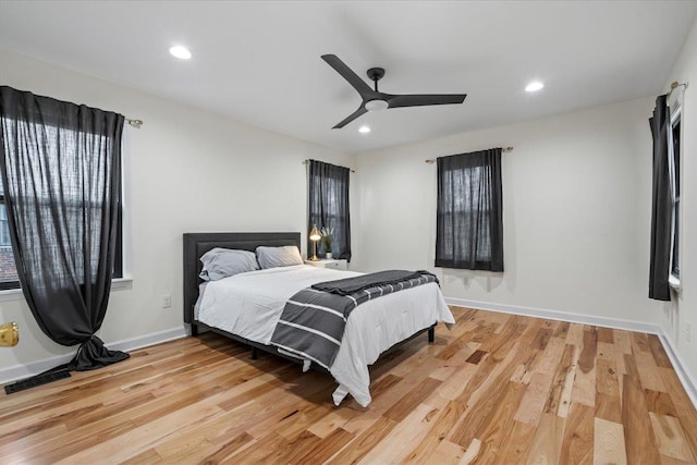 bedroom featuring ceiling fan and light hardwood / wood-style floors