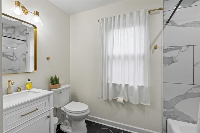 bathroom featuring tile patterned floors, vanity, and toilet