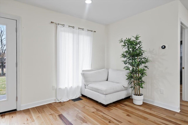 unfurnished room with wood-type flooring