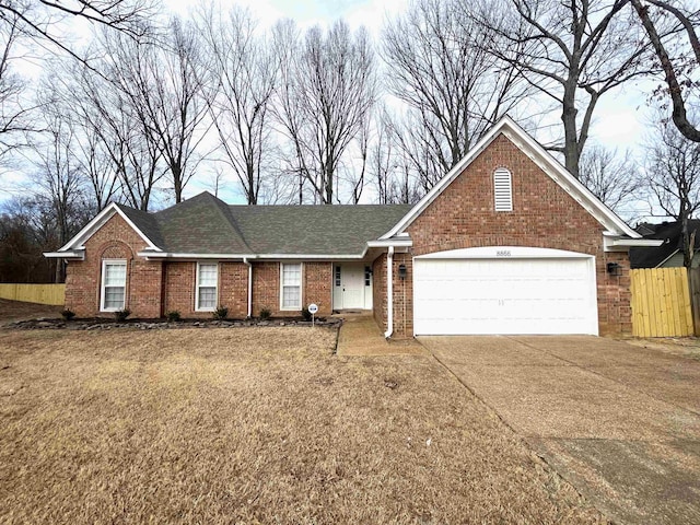 ranch-style home featuring a garage