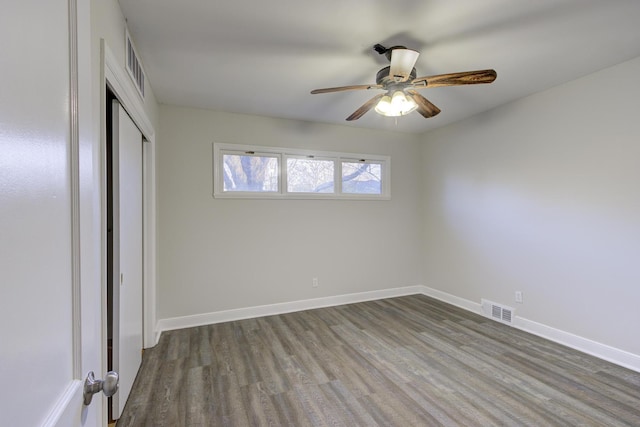 unfurnished bedroom with ceiling fan, hardwood / wood-style floors, and a closet