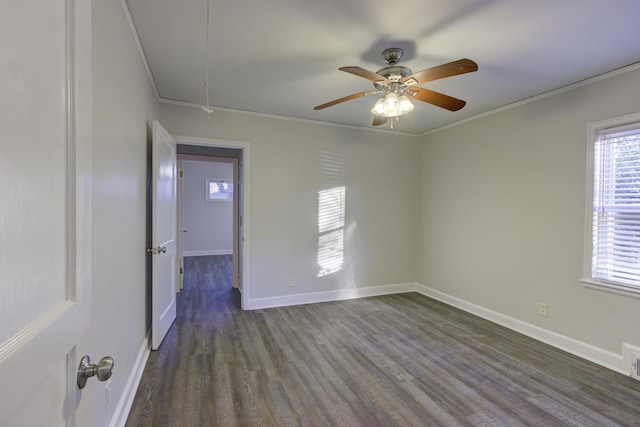 empty room featuring ornamental molding, dark hardwood / wood-style floors, and ceiling fan