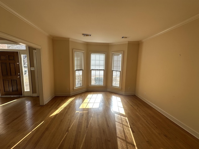 interior space featuring crown molding and dark wood-type flooring