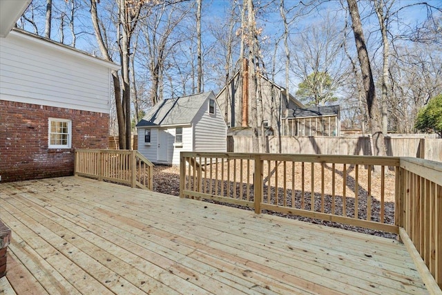 wooden deck with a shed