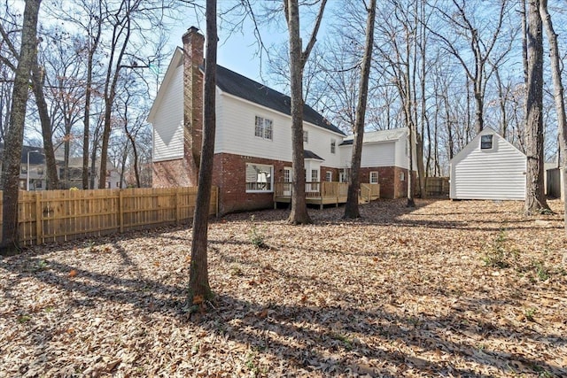 rear view of house with a wooden deck