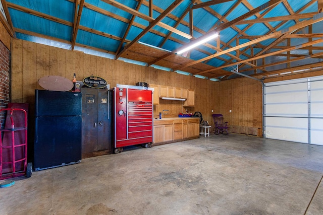 garage featuring black refrigerator