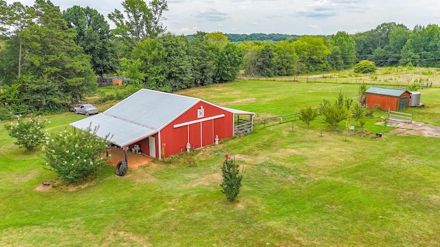 birds eye view of property featuring a rural view