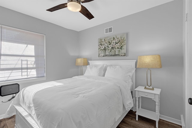 bedroom featuring dark wood-type flooring and ceiling fan