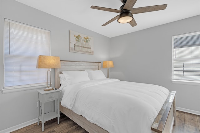 bedroom featuring dark hardwood / wood-style floors and ceiling fan