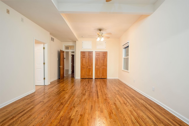 unfurnished bedroom featuring ceiling fan and light hardwood / wood-style floors